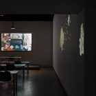 Trisha Baga, <em>The Voice</em>, 2017–18. 3D video with podium, furniture, and three 2D-video projections. Installation view at Gallery TPW. Documentation: Toni Hafkenscheid.