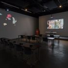 Trisha Baga, <em>The Voice</em>, 2017–18. 3D video with podium, furniture, and three 2D-video projections. Installation view at Gallery TPW. Documentation: Toni Hafkenscheid.