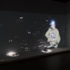 Trisha Baga, <em>Department of Interior (sketch for untitled technothriller)</em>, 2018. 3D video projection with bucket and painted rocks. Installation view at Gallery TPW. Documentation: Toni Hafkenscheid.