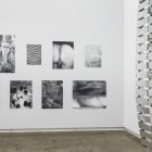 Eileen Quinlan, <em>Enough</em>, silver gelatin prints. Laurie Kang, <em>A Body Knots</em>, steel studs, flex-track, hardware. Installation view at Gallery TPW. Documentation: Toni Hafkenscheid.