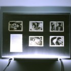 Eric Baudelaire, <em>The Makes (Out of Desperation)</em>. found Japanese film stills, page torn from That Bowling Alley on the Tiber by Michelangelo Antonioni, Plexiglas, steel and fluorescent tubing, 2009
