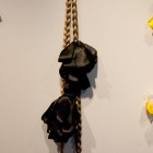 Christine Negus, <em>oh, those sad lonely beasts! (cosmos)</em>, 4 wreaths, 4 falls and 1 braid with artificial hair, ribbon and artificial flowers, 2011-2012